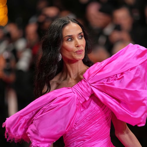 Jury member Demi Moore poses for photographers upon arrival at the premiere of the film 'Paper Tiger' at the 79th international film festival, Cannes, southern France, Saturday, May 16, 2026. (AP Photo/Andreea Alexandru)