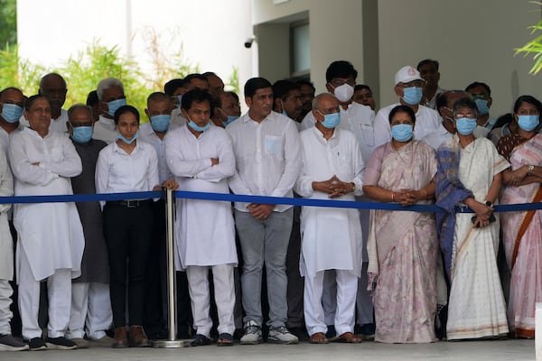 Political leaders gather to pay respect to the body of former Chief Minister of Gujarat Vijay Rupani, victim of Thursday's Air India plane crash, at a hospital in Ahmedabad, India, Monday, June 16, 2025. (AP Photo/Ajit Solanki)