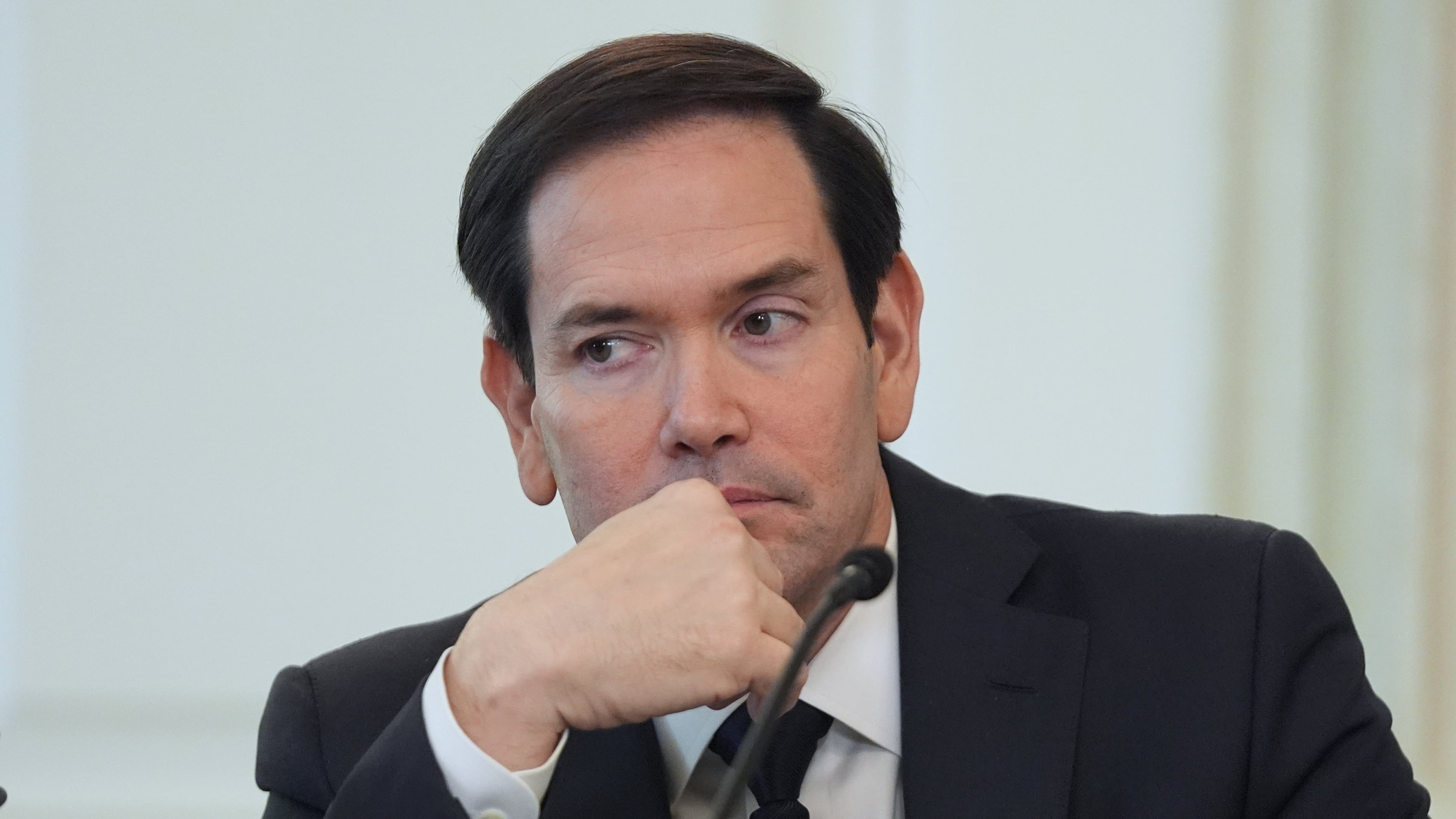 Secretary of State Marco Rubio listens before interrupting President Donald Trump during a roundtable meeting on antifa in the State Dining Room at the White House, Wednesday, Oct. 8, 2025, in Washington. (AP Photo/Evan Vucci)