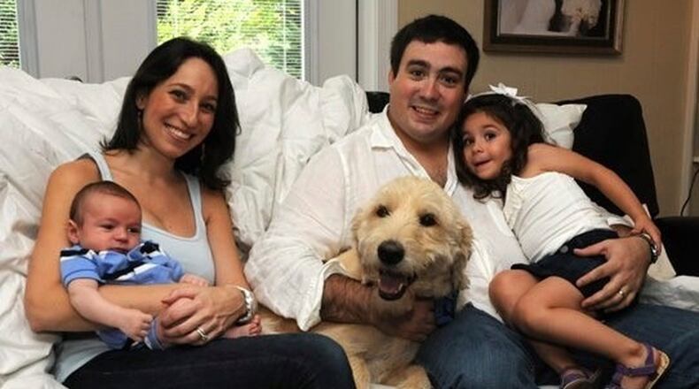 Emily and Kurt Moore of Dunwoody with their son, Jordan, their daughter, Hallie, and the family dog, a labradoodle named Bear Bryant, in the spring of 2012. CONTRIBUTED