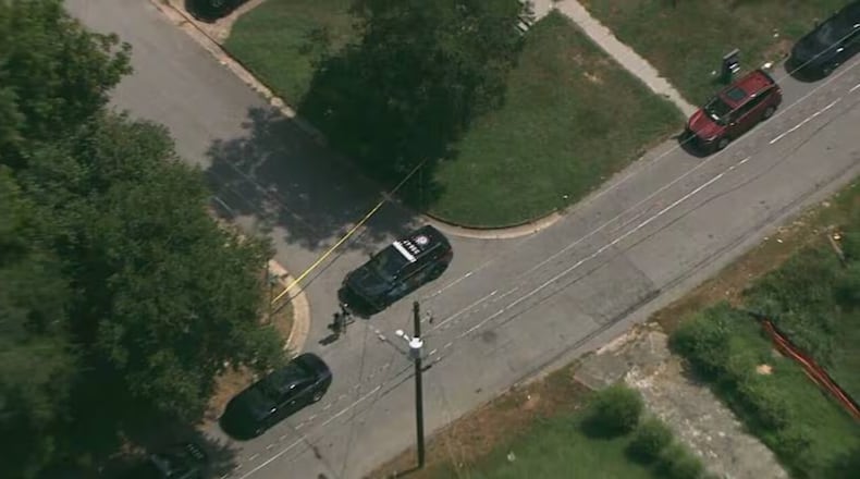 Atlanta police officers investigate a fatal shooting on Hill Street near Center Hill Park.