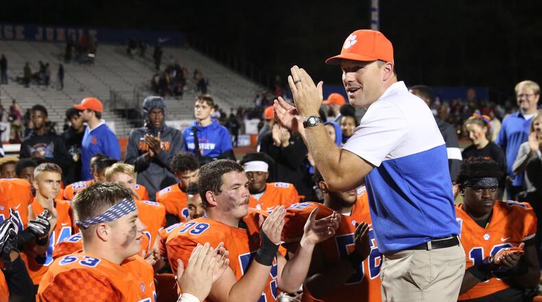 Parkview coach Eric Godfree, right, celebrates with the team after their win against Brookwood at Parkview High School Friday, October 25, 2019 in Lilburn, Ga. Parkview won 50-19. (JASON GETZ/SPECIAL TO THE AJC)