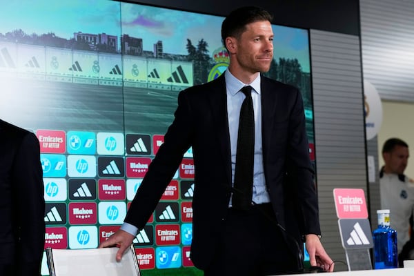 Former footballer Xavi Alonso arrives for a press conference during his presentation as Real Madrid's new coach at the Club's headquarters in Madrid on Monday 26 May 2025. (AP Photo/Jose Breton)