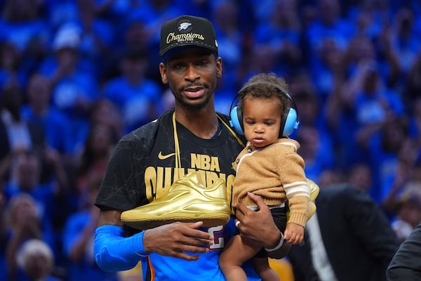 Oklahoma City Thunder guard Shai Gilgeous-Alexander celebrates after they won the NBA basketball championship with a Game 7 victory against the Indiana Pacers Sunday, June 22, 2025, in Oklahoma City. (AP Photo/Julio Cortez)