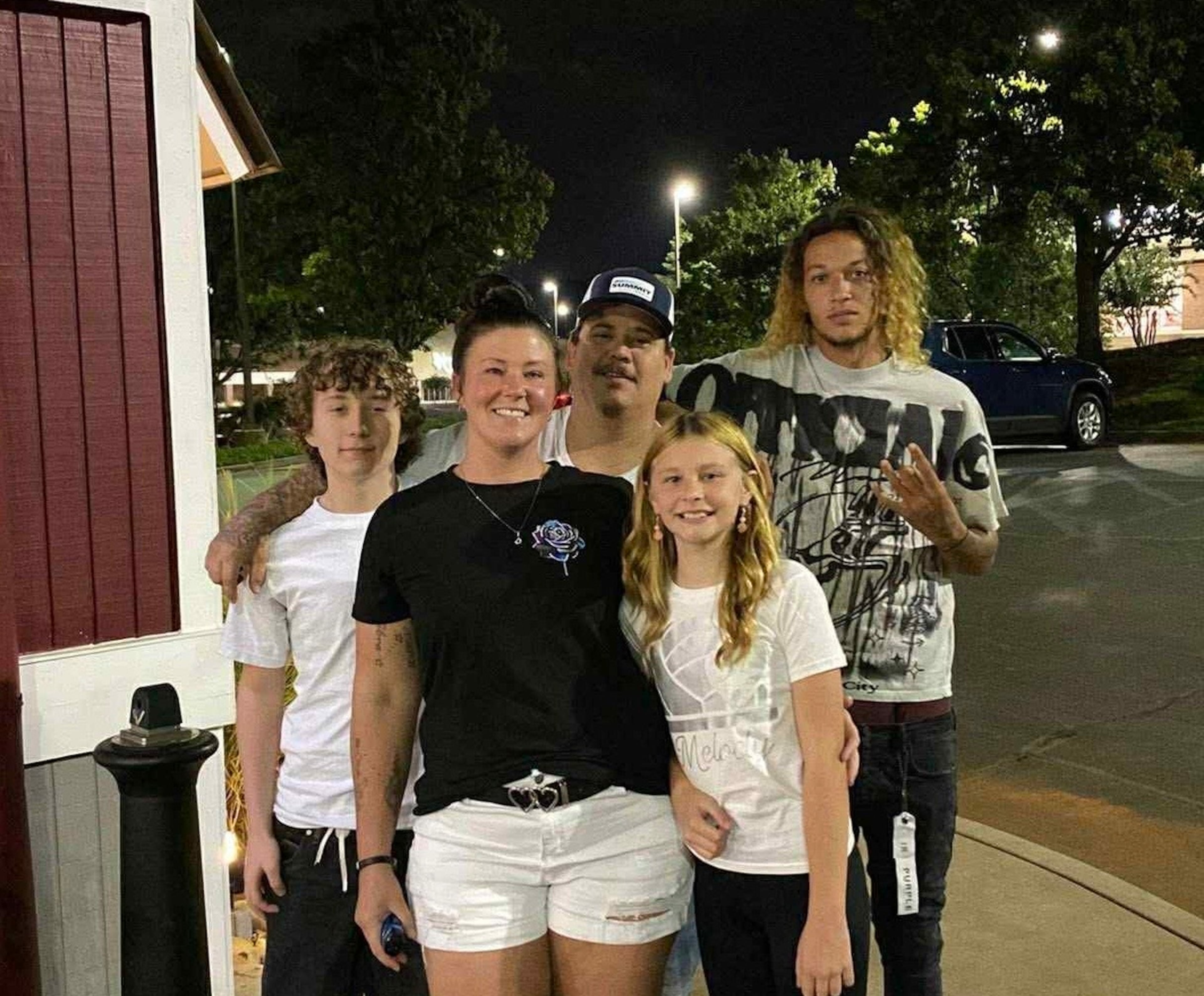 Xavier Thompson (right) died after a car wreck in Cartersville. His mother, Danielle Walker (center), and family created a memorial for him and his three friends who also died in the crash. (Courtesy of Danielle Walker)