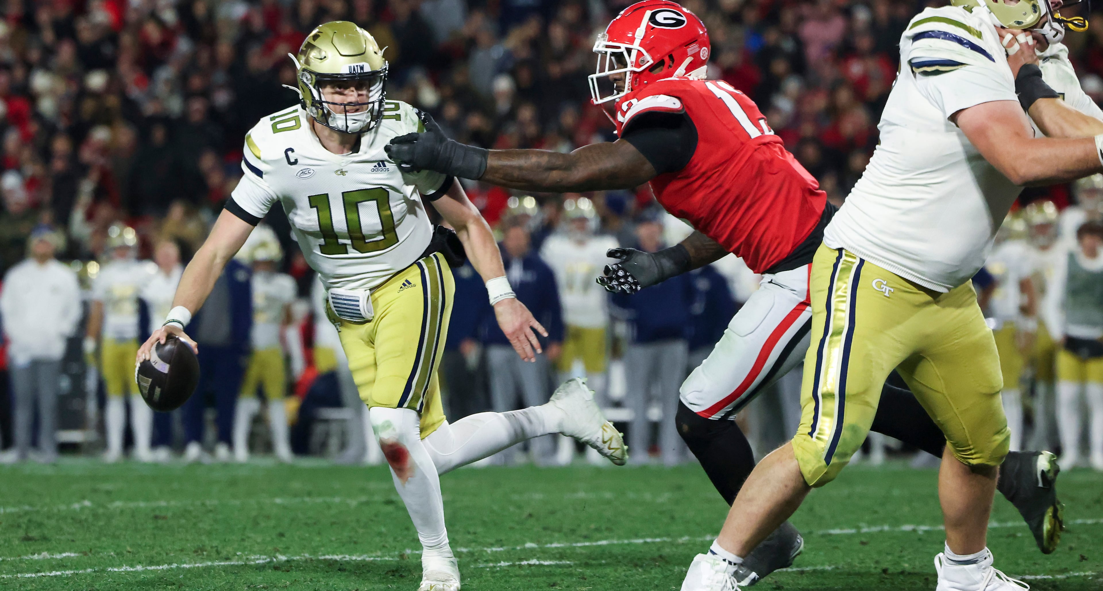 “I knew he was a great player but, after that day, I was like, ‘He was a full-grown man,’” the University of Georgia's former coach said of Georgia Tech quarterback Haynes King (left). (Jason Getz/AJC)