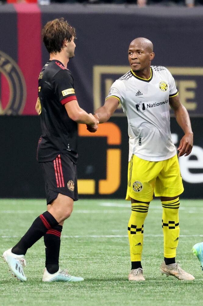 Columbus Crew midfielder Darlington Nagbe, right, a former Atlanta United player, greets Atlanta United midfielder Santiago Sosa (5) after their game. JASON GETZ FOR THE ATLANTA JOURNAL-CONSTITUTION