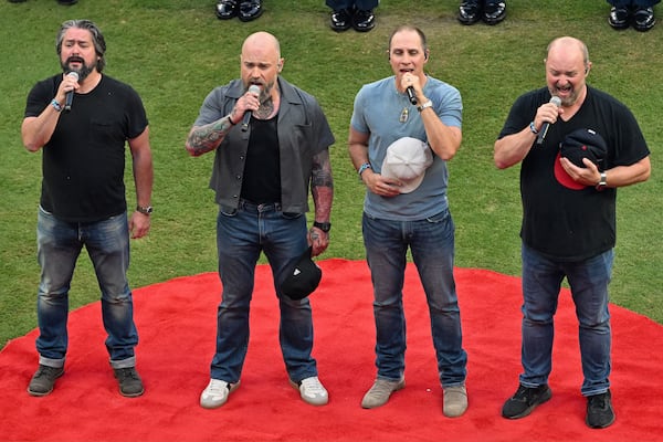 Members of Zac Brown Band sing the U.S. National Anthem to open the MLB All-Star Game at Truist Park in Atlanta on Tuesday, July 15, 2025. (Hyosub Shin/AJC)