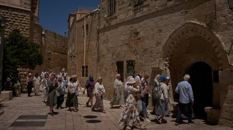Christian pilgrims visit the Cenacle, traditionally believed to be the site of the Last Supper, in Jerusalem, Friday, May 1, 2026, as they walk past the site where a nun was attacked by a man last Wednesday. (AP Photo/Leo Correa)