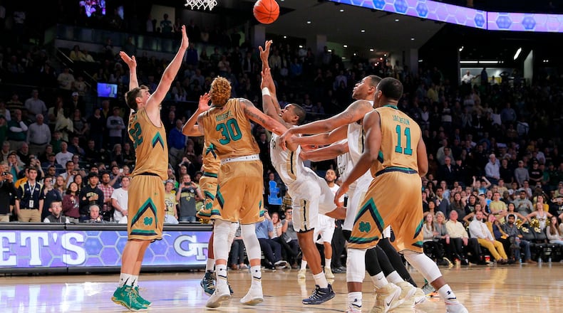 Georgia Tech guard Marcus Georges-Hunt (3) shoots the winning basket in the final seconds of an NCAA college basketball game against Notre Dame in Atlanta, Saturday, Feb. 20, 2016. Georgia Tech won 63-62. (AP Photo/Todd Kirkland)
