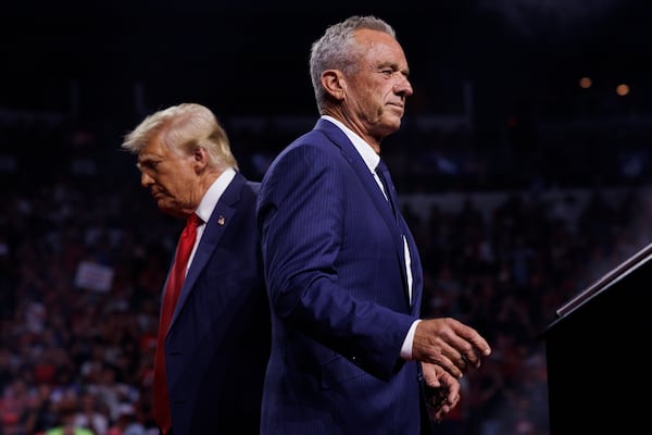 In a newspaper editorial, six former surgeons general wrote that Health and Human Services  Secretary Robert F. Kennedy Jr. (right) is a danger to the American people. (Tom Brenner for The Washington Post)

