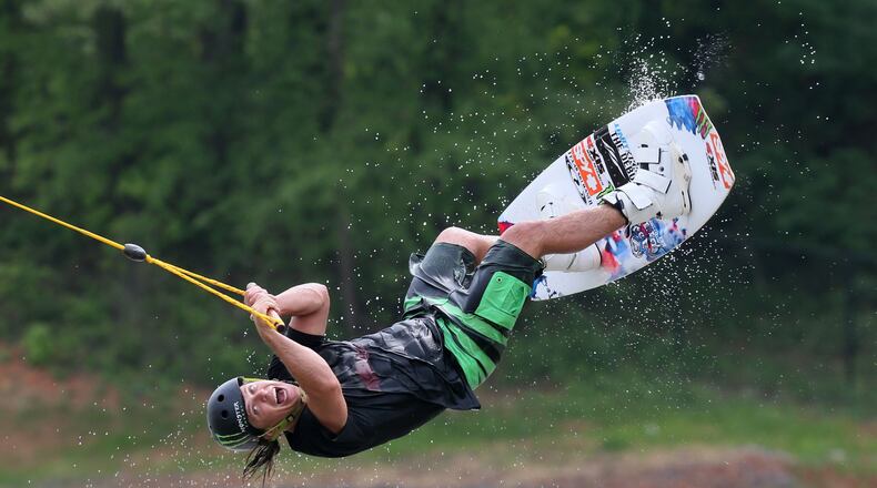Terminus Wake Park, the first part of the sports complex to open, held a Liquid Force Free for all Monday with free riding, demo boards, food, and instruction. Here, wakeboard team member Tom Fooshee tries out one of the jumps. BOB ANDRES / BANDRES@AJC.COM