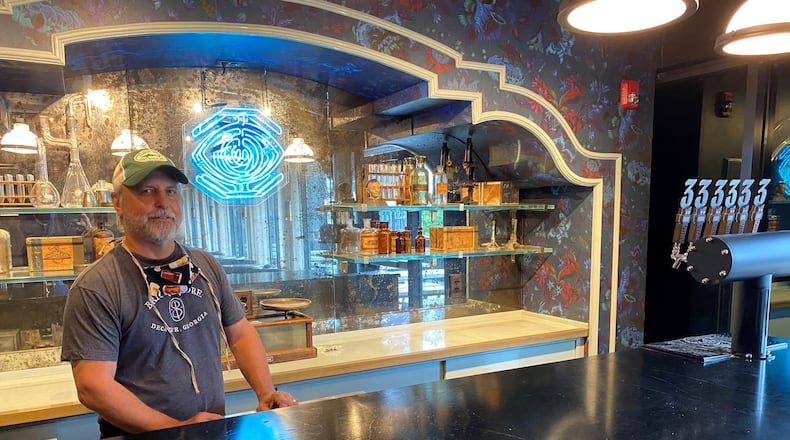 Brian Purcell stands behind the Apothecary bar inside the Three Taverns Imaginarium at the Atlanta Dairies development on Memorial Drive. CONTRIBUTED BY BOB TOWNSEND
