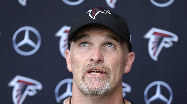 June 13, 2017, Flowery Branch: Falcons head coach Dan Quinn is looking up as he sums up the first day of mini-camp on Tuesday, June 13, 2017, in Flowery Branch. Curtis Compton/ccompton@ajc.com