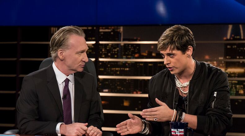 In this photo provided by HBO, host Bill Maher, left, listens to Milo Yiannopoulos, a writer for Breitbart News, on HBO's "Real Time with Bill Maher," Friday, Feb. 17, 2017, in Los Angeles. (Janet Van Ham/HBO via AP)