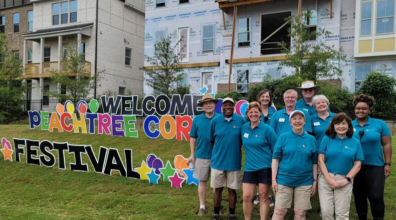 The Peachtree Corners Festival returns this year to Sept. 23-24 and will honor its founder and First Lady of Peachtree Corners, Debbie Mason (shown in photo center with white cap). COURTESY PEACHTREE CORNERS FESTIVAL