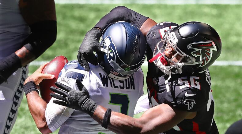 Falcons defensive end Dante Fowler helps sack Seattle Seahawks quarterback Russell Wilson. “Curtis Compton / Curtis.Compton@ajc.com”