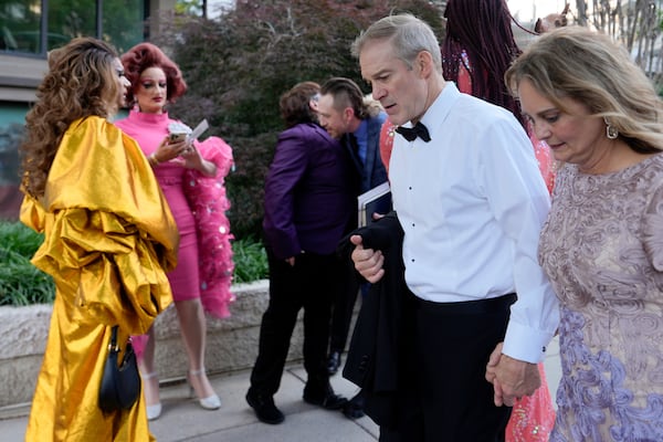 Rep. Jim Jordan, R-Ohio, and Polly Jordan walk past Tara Hoot, Ricky Rosé, Vagenesis and Maria Con Carne outside the Kennedy Center, to attend Les Miserables, Wednesday, June 11, 2025, in Washington, on the night that President Donald Trump and first lady Melania Trump were also attending. (AP Photo/Julia Demaree Nikhinson)