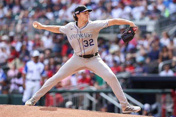 Colorado Rockies pitcher Chase Dollander (32) delivers in the first inning of a baseball game against the Atlanta Braves, Saturday, June 14, 2025, in Atlanta. (AP Photo/Colin Hubbard)