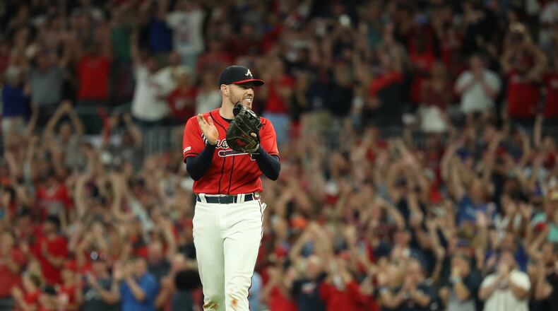 Freddie Freeman celebratesa. (JASON GETZ/SPECIAL TO THE AJC)