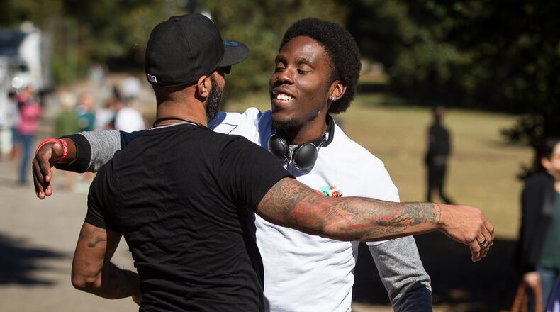 LaMar Yarborough greets a friend while volunteering at the 25th Annual AIDS Walk Atlanta & 5K Run in Piedmont Park Sunday, October 18, 2015. STEVE SCHAEFER / SPECIAL TO THE AJC
