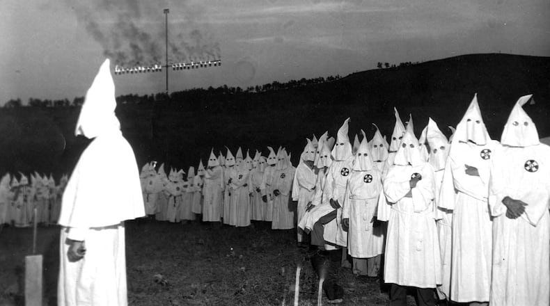 At an initiation ceremony for 700 members, the Ku Klux Klan burns a huge cross on Stone Mountain on July 23, 1948.