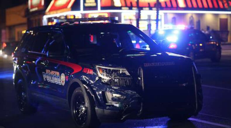 An Atlanta police officer was temporarily trapped after an accident on Spring Street at North Avenue in May, police said. AJC file photo