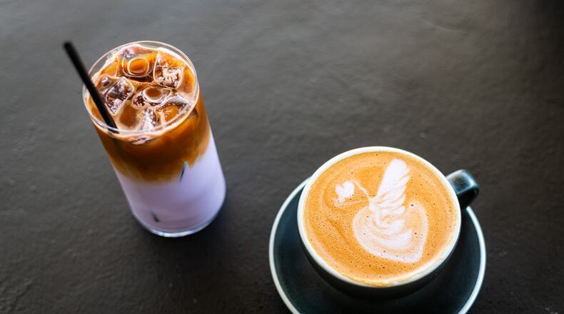 The coconut ube latte, both iced and hot, from Postern Coffee in Doraville, is easy to make at home using a simple recipe for the flavored syrup. (Henri Hollis / AJC)