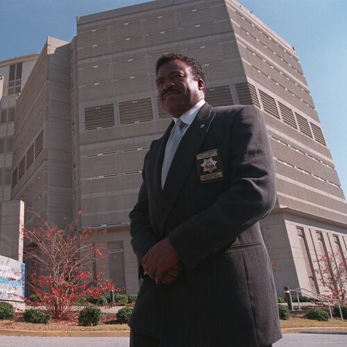 DeKalb Sheriff Sidney Dorsey standing in front of the DeKalb County Jail on Memorial Drive, Dec. 4, 1998. (Renee' Hannans/AJC file photo)
