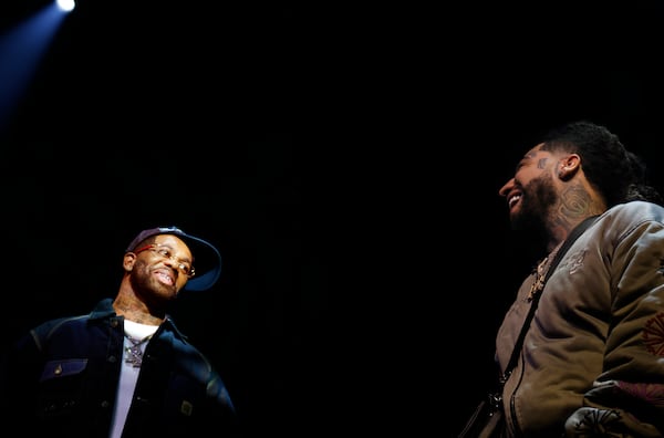 Atlanta rapper Hoodrich Pablo Juan, left, shares the stage with fellow rapper RX Hector, as he prepares for his first performance since his recent release from prison at Center Stage on Saturday, Nov. 29, 2025. (Akili-Casundria Ramsess, EyeAkili Media for The Atlanta Journal-Constitution)