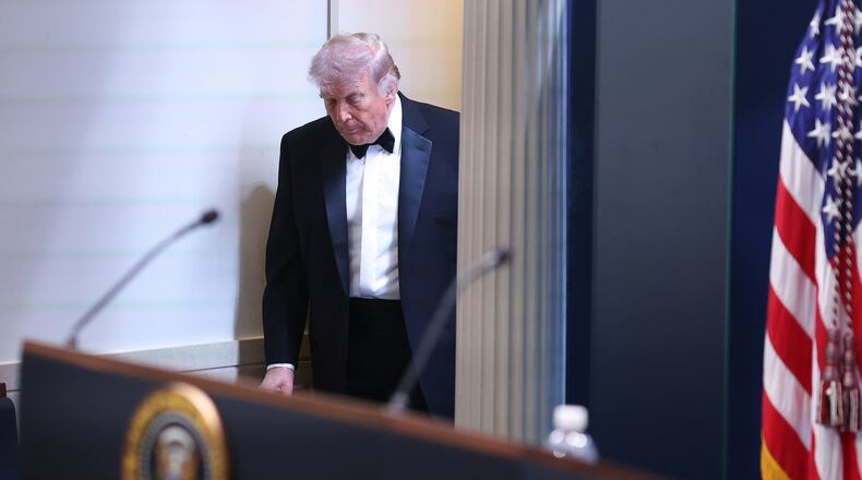 President Donald Trump arrives at the James Brady Press Briefing Room at the White House after an unspecified threat at the annual White House Correspondents' Association Dinner in Washington, Saturday, April 25, 2026. (AP Photo/Tom Brenner)