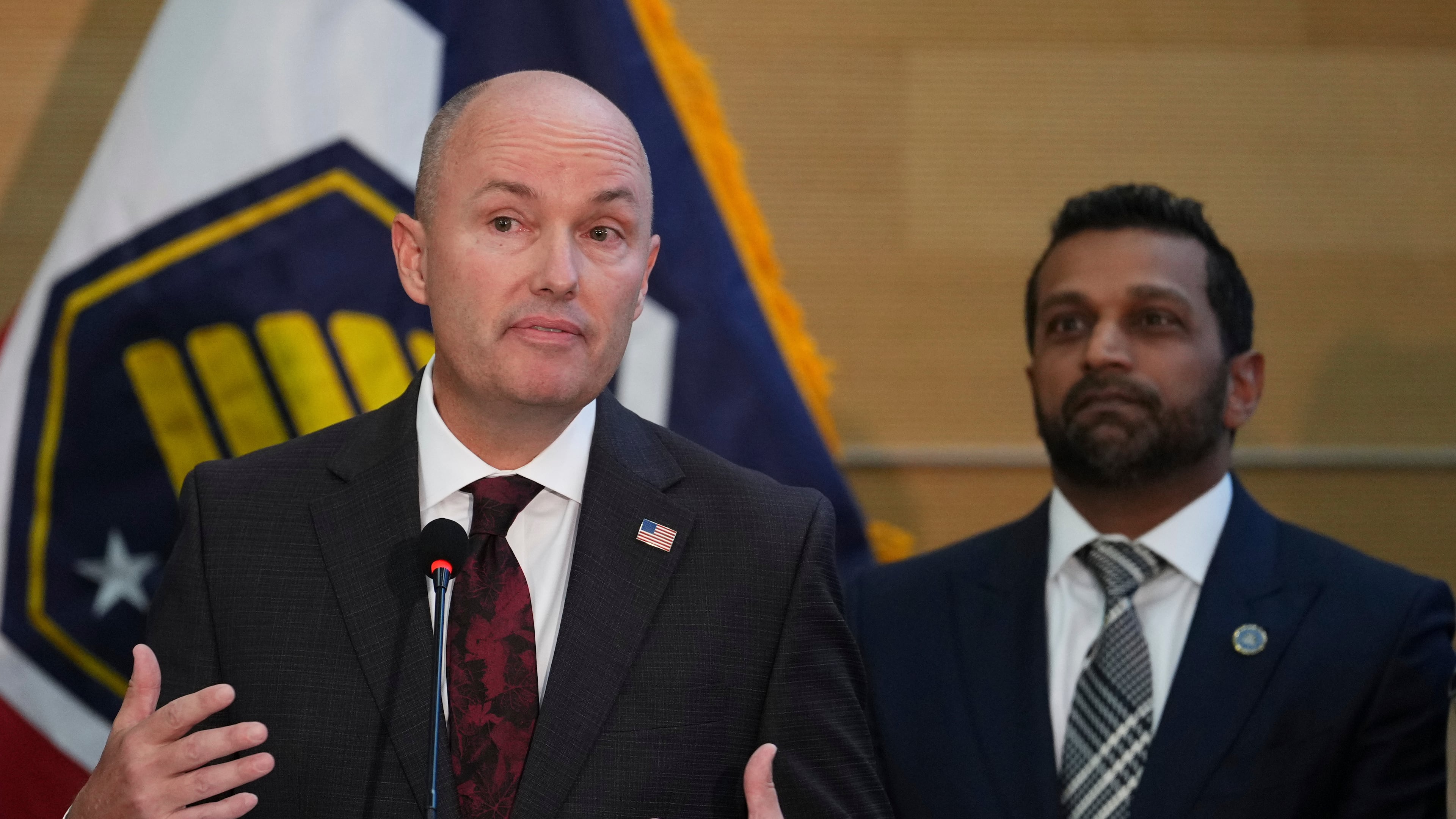 Utah Gov. Spencer Cox speaks at a news conference, as FBI Director Kash Patel looks on, Friday, Sept. 12, 2025, in Orem, Utah, (AP Photo/Lindsay Wasson)