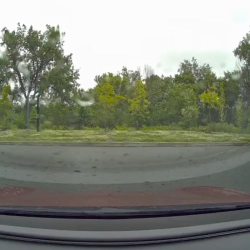 This image taken from video shows a view from a car dashcam when a meteor produced two loud booms over Cambridge, Mass., Saturday, May 30, 2026. (Stanley Fung via AP)