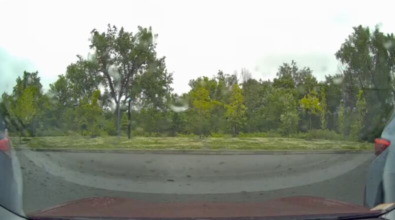 This image taken from video shows a view from a car dashcam when a meteor produced two loud booms over Cambridge, Mass., Saturday, May 30, 2026. (Stanley Fung via AP)