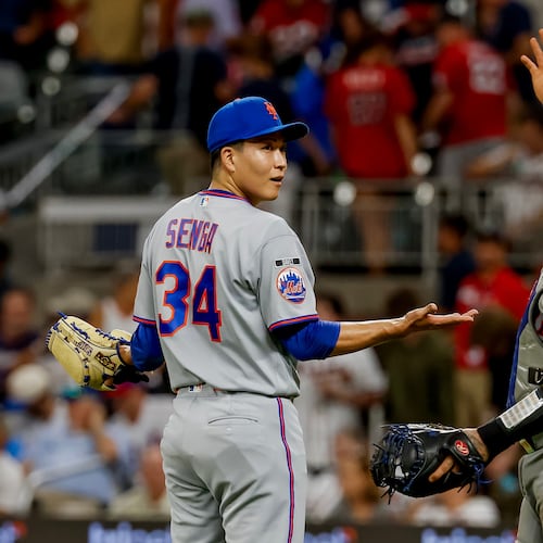 New York Mets pitcher Kodai Senga, left, reacts with catcher Francisco Alvarez, right, after closing out the Atlanta Braves during the ninth inning of a baseball game, Monday, Aug. 10, 2026, in Atlanta. (AP Photo/Erik S. Lesser)