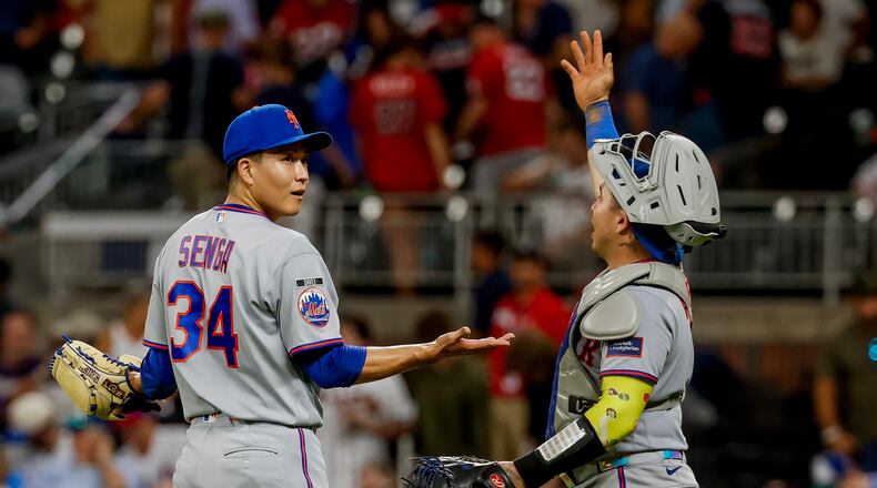 New York Mets pitcher Kodai Senga, left, reacts with catcher Francisco Alvarez, right, after closing out the Atlanta Braves during the ninth inning of a baseball game, Monday, Aug. 10, 2026, in Atlanta. (AP Photo/Erik S. Lesser)