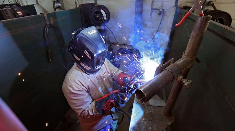 Nov. 13, 2015 - A Lanier Charter Career Academy student works on a MIG welding assignment in a class at nearby Lanier Technical College. BOB ANDRES / BANDRES@AJC.COM