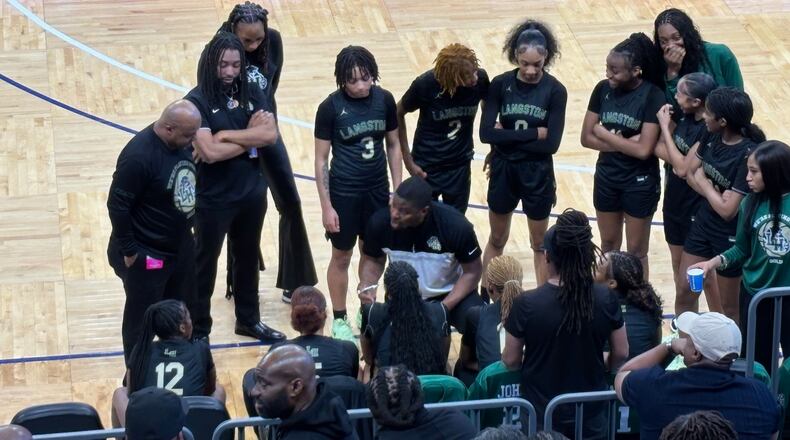 Hughes coach Xavier Trice instructs his girls basketball team during a timeout of their semifinal game vs. Bradwell Institute at Georgia State on Feb. 28, 2025.
