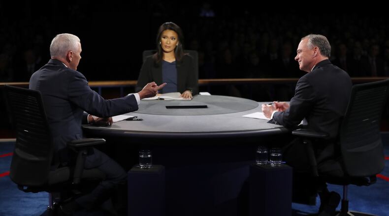 FARMVILLE, VA - OCTOBER 04: Republican vice presidential nominee Mike Pence (L) speaks as Democratic vice presidential nominee Tim Kaine (R) and debate moderator Elaine Quijano (C) listen during the Vice Presidential Debate at Longwood University on October 4, 2016 in Farmville, Virginia. This is the second of four debates during the presidential election season and the only debate between the vice presidential candidates. (Photo by Joe Raedle/Getty Images)