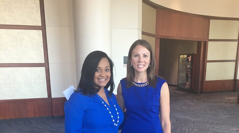 Nikema Williams, left, and state Rep. Stacey Evans, right, on the sidelines of Mike Pence's Cobb County rally on Aug. 29, 2016. GREG BLUESTEIN/AJC
