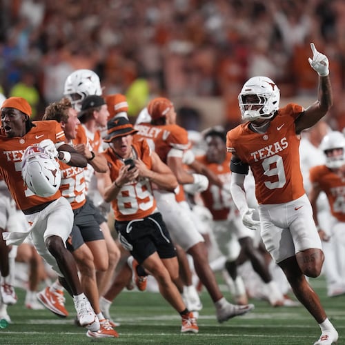 Texas players celebrate their win over Ohio State in an NCAA college football game in Austin, Texas, Saturday, Sept. 12, 2026. (AP Photo/Eric Gay)