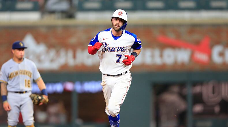 Dansby Swanson #7 of the Atlanta Braves circles the bases after hitting a seventh-inning grand slam during the Saturday evening MLB game between the Atlanta Braves and the Milwaukee Brewers on July 31, 2021 at Truist Park in Atlanta, Georgia. (Photo by David J. Griffin/Icon Sportswire) (Icon Sportswire via AP Images)
