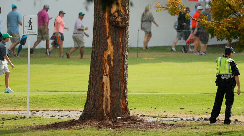 Fans exit East Lake past the pine tree scarred by a lightning strike Saturday afternoon. (Photo by Kevin C. Cox/Getty Images)