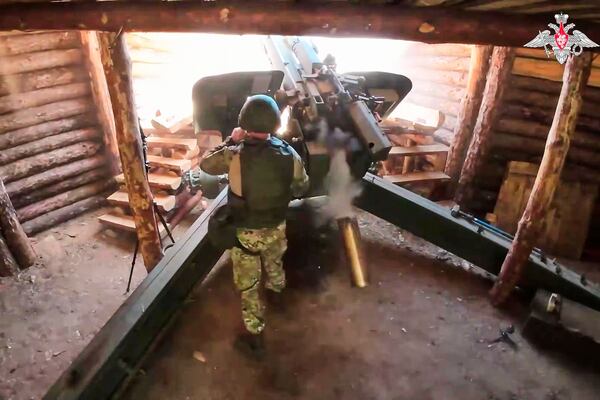 In this photo taken from video distributed by Russian Defense Ministry Press Service on Wednesday, July 16, 2025, a Russian soldier fires a 152 mm howitzer 2A65 Msta-B towards Ukrainian position in an undisclosed location in Ukraine. (Russian Defense Ministry Press Service via AP)