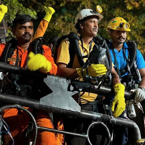 In this image provided by the Information and Public Relations Department, Government of Sikkim, rescue workers stand outside an under-construction tunnel at a hydropower project in Samardung village, about 40 kilometers (25 miles) from Gangtok, India, Wednesday, July 22, 2026. (Government of Sikkim via AP)