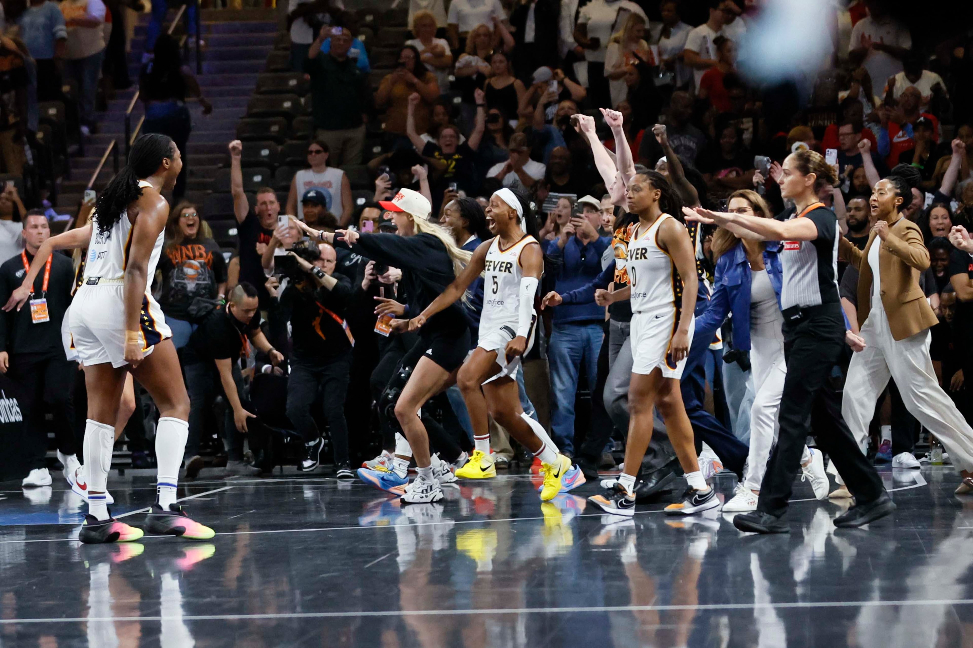 Indiana Fever players celebrate after defeating the Atlanta Dream 87-85 to advance to the next round at Gateway Center Arena on Thursday, Sept. 18, 2024, in Atlanta. The Atlanta Dream lost 87-85. (Miguel Martinez/ AJC)