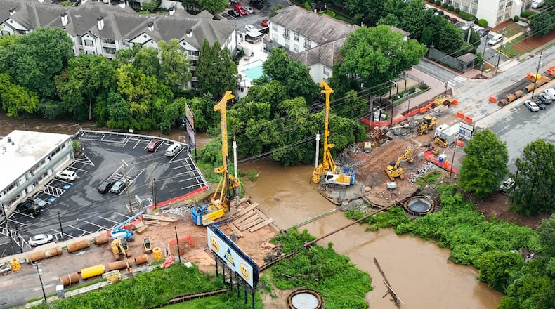 July 21, 2022 Atlanta - Aerial photograph shows construction area where the bridge along Cheshire Bridge Road, which crosses over Peachtree Creek, was demolished after the fire August 4 last year on Thursday, July 21, 2022. (Hyosub Shin / Hyosub.Shin@ajc.com)
