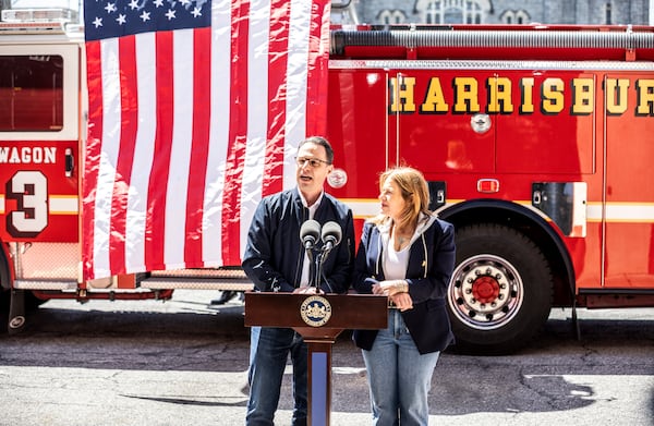 Pennsylvania Gov. Josh Shapiro and first lady Lori Shapiro answer questions during a news conference after serving lunch to firefighters to thank them for responding to Sunday's arson attack at the Governor's Residence, Thursday, April 17, 2025. (Dan Gleiter/The Patriot-News via AP)