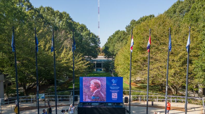 Video screen set up in front of the Jimmy Carter Library and Museum in Atlanta, showing a mosaic of people wishing President Carter a happy 99th birthday in September of 2023. Photo by Michael A. Schwarz/The Carter Center