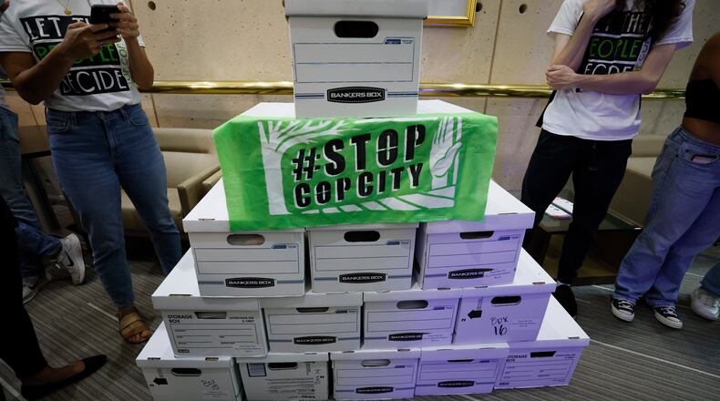 Sixteen boxes with more than 100,000 signatures await inside the City Hall Clerk's office, ready to be processed and accepted; opponents of Atlanta's planned public safety training center presented their petition to have the matter of the training center included on the ballot for general consideration. (Miguel Martinez/The Atlanta Journal-Constitution/TNS)